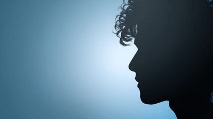 Striking silhouette captures woman with flowing hair emphasizing form and elegant style.