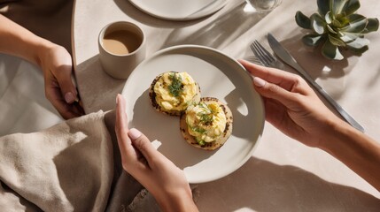 Delicious breakfast served on a minimalistic table with freshly brewed coffee and two eggs on toast