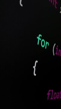 Closeup macro shot movement of coding script moving across LED screen with real-time AI-generated typing, showcasing advanced AI learning in optimization, debug and coding for software development.