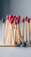 Close-Up of Burnt and Unburnt Matches, Symbolizing Burnout, Resilience, and the Importance of Mental Health Awareness in the Workplace : Generative AI