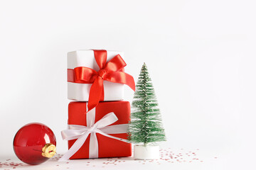 Beautiful Christmas gift boxes and decor on white background