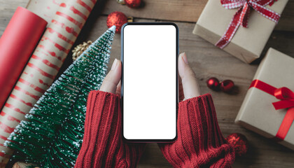 An image of a smartphone decorated for Christmas