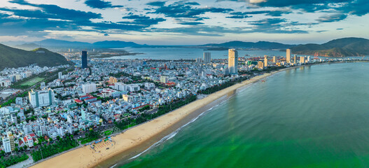 Obraz premium Aerial view of the coastal city of Quy Nhon, Vietnam in the morning, beautiful coastline. This is a city that attracts to relax in central Vietnam