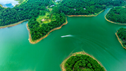 Aerial view of Tuyen Lam lake in Dalat, Vietnam with blue water and paradise islands below give this place a relaxing tourist attraction. This is a hydroelectric lake that provides energy for highland © huythoai