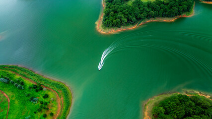 Aerial view of Tuyen Lam lake in Dalat, Vietnam with blue water and paradise islands below give this place a relaxing tourist attraction. This is a hydroelectric lake that provides energy for highland