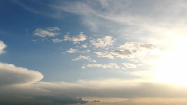 Fresh after-rain sky reveals a patchwork of clearing clouds and hints of bright, renewed sunlight abstract, sunlight, light