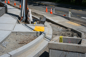 Public road construction project, new sidewalk and retaining wall, ADA accessible access on corner...