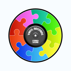 Long play vinyl record colorful puzzle with paper black in the middle.