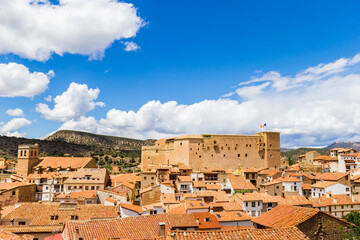 Skyline with the historic castle and church in Mora de Rubielos, Spain
