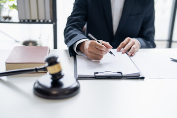 Lawyer Businessman Working with Lawbook and Gavel in Office or Courtroom for Justice Concept