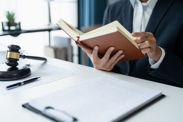 Lawyer Businessman Working with Lawbook and Gavel in Office or Courtroom for Justice Concept