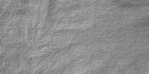 Grey terry towel cloth structure closeup photo. Structure of gray terry fabric