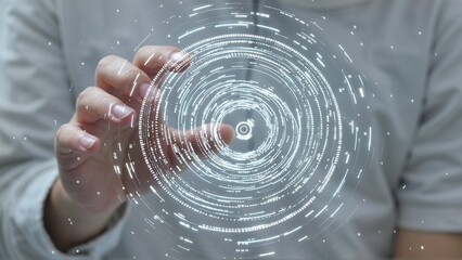 Person interacting with a futuristic glowing circular data visualization, representing complex information.
