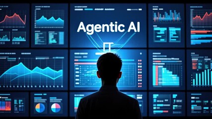 Silhouette of a person facing a large digital screen wall displaying dynamic data graphs and charts with the central glowing text agentic ai, conveying focus and technological advancement - Powered by Adobe