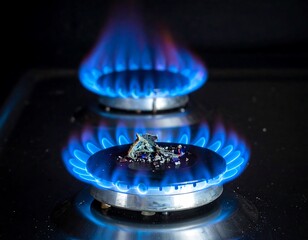 Two gas burners with bright blue flames