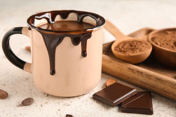 Cup of hot chocolate on white grunge background