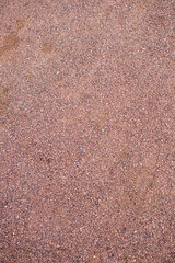 The background is made of red granite