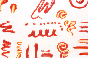 Different patterns made of tasty ketchup on white background