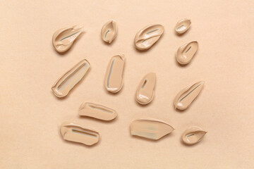 Samples of makeup foundation on beige background