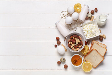 Different products on white wooden background. Food Allergy Awareness Month
