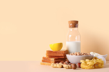 Different products on beige table. Food Allergy Awareness Month
