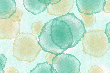 green and yellowl watercolor drops on a white background.