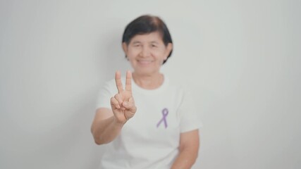 Elderly with Purple Ribbon for Violence, Pancreatic, Esophageal, Testicular cancer, Alzheimer, Epilepsy, Lupus, Crohn, Thyroid,  Sarcoidosis and Fibromyalgia. Awareness month and World cancer day