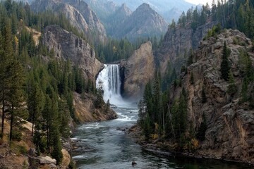Majestic waterfall cascading into a river valley, surrounded by towering mountains and forest
