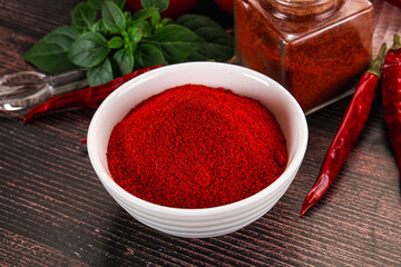 Spicy dry paprika powder in the bowl