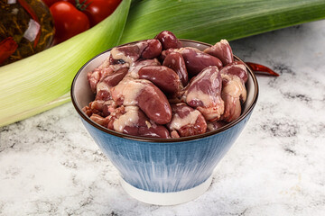Raw chicken hearts in the bowl
