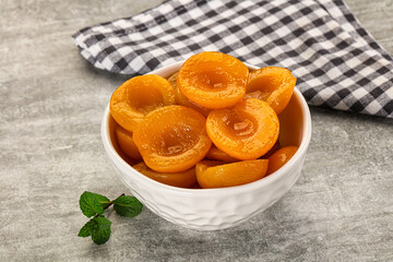Sweet canned apricots with syrope