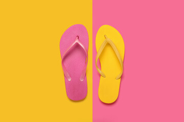 Composition with stylish flip-flops on color background