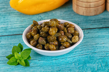 Pickled canned capers in the bowl