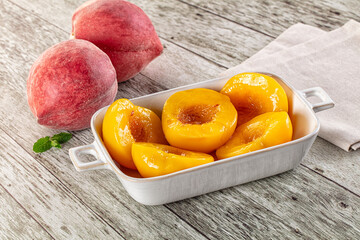Sweet ripe yellow canned peaches