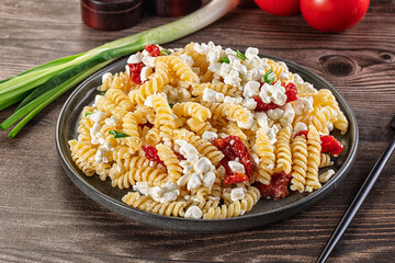 Italian pasta fusili with curd