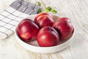 Ripe sweet juicy nectarines heap