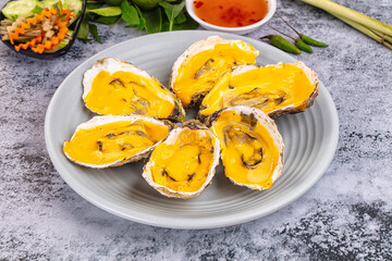 Baked oyster with cheddar cheese