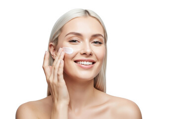 Attractive young woman applying cosmetic cream on her face isolated on transparent background skincare and beauty concept close up portrait