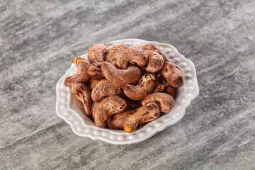 Unpeeled cashew nuts in the bowl
