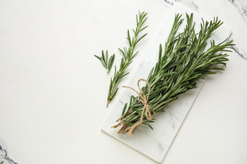 Bunch of fresh rosemary on marble background
