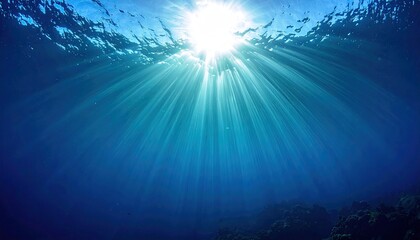Underwater Sunlight Streaming Through Deep Blue Ocean Water With Sunrays and Seaweed Casting Shadows From Below View in Wide Angle