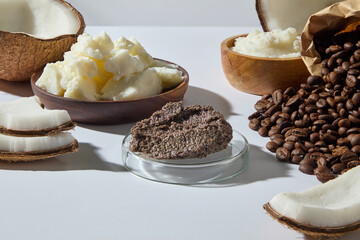 Close-up of coconuts, roasted coffee beans, and skincare butter bowl. Perfect detailed photo for...
