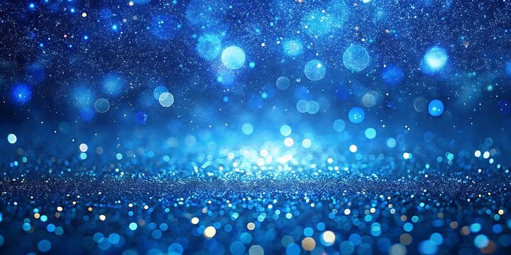 Abstract blue bokeh lights sparkle and shine creating a dreamy magical and festive atmosphere of celebration and wonder