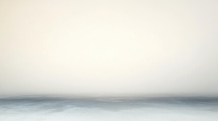 Obraz premium Calm and misty seascape with gentle waves blending into a soft, pale sky creating a serene and peaceful atmosphere