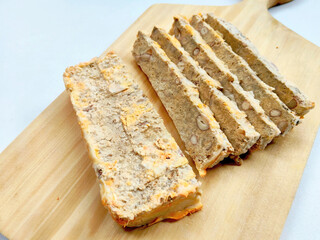 Microstock Food Image: Homemade Oncom Batang (Oncom Stick) Displayed on a Light Wooden Surface