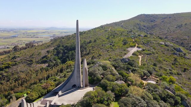 Drone tilt-up reveal shot of Afrikaans language monument on Paarl mountain