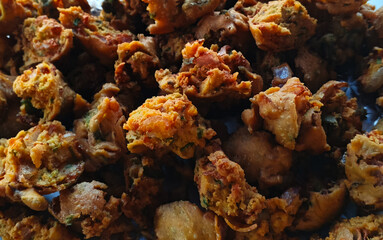 top view of Pakoda Snacks , Indian or Pakistani potato Pakora are famous street food in South Asia and also loved by other countries.