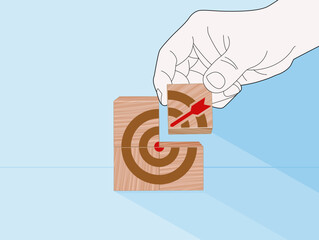 Precision Planning to Hit the Business Target, Hand places final arrow block to complete red bullseye puzzle