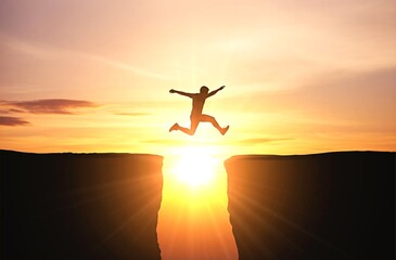 Leap of Courage Toward Success at Sunset, Silhouette jumps across cliffs with sunburst in dramatic sky