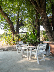Shady Tree Cafe Patio with White Wooden Furniture.